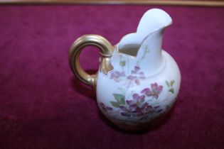 A Royal Worcester blush ivory hand painted jug with initials S. H to base