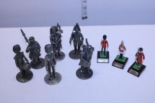 A selection of metal military figurines
