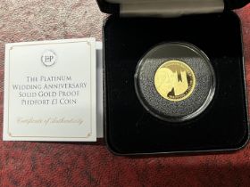 A limited edition Jubilee Mint 22ct gold piedfort proof one pound coin. Strike date 20th November