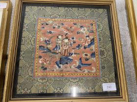 A framed antique embroidered silk panel