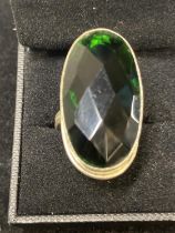 A 925 silver ring with green stone