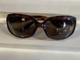 A pair of vintage Dior sunglasses (scratch to lens)