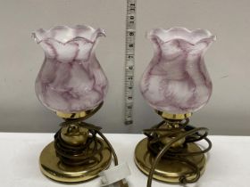 Two brass bedside table lamps with pink glass shades, shipping unavailable