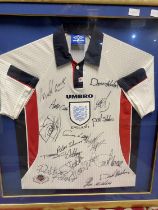 A framed and signed England football shirt (authenticity unknown). Collection only