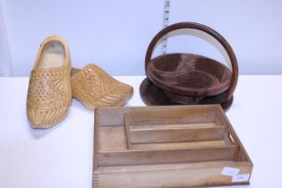 A selection of assorted treen items including a pair of wooden clogs