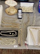 A large selection of assorted graduated pearl necklaces etc