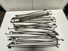 A selection of antique violin bows