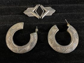 A pair of art deco vintage white metal hoop earrings and white metal brooch