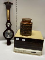 A vintage 1960's bread bin with a Hornsea kitchen container and a barometer