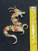 A costume jewellery brooch in the form of a dragon