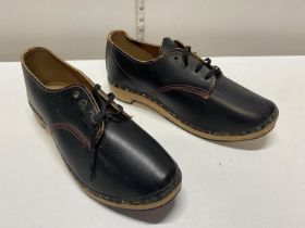A pair of handmade wooden soled shoes
