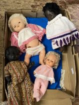 A selection of vintage dolls and other accessories