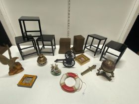 A selection of collectibles including oriental stands and a model cannon