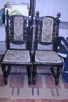 A pair of late Victorian hand carved ebonized chairs (one needs attention). Shipping unavailable