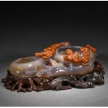 A Chinese Carved Agate Peach Form Washer