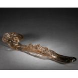 A Chinese Carved Smoky Quartz Ruyi Scepter