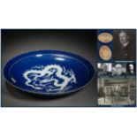 A Chinese Blue and White Reserve Decorated Dragon Dish