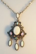 Opalanhänger. Neun Opale in Silberfassung. H 8 cm. Dazu Silberkette, L 56 cm
