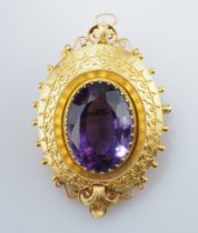 Reizende Amethystbrosche, auch als Anhänger zu tragen. Großer, ovaler Amethyst in GG-Fassung mit fi