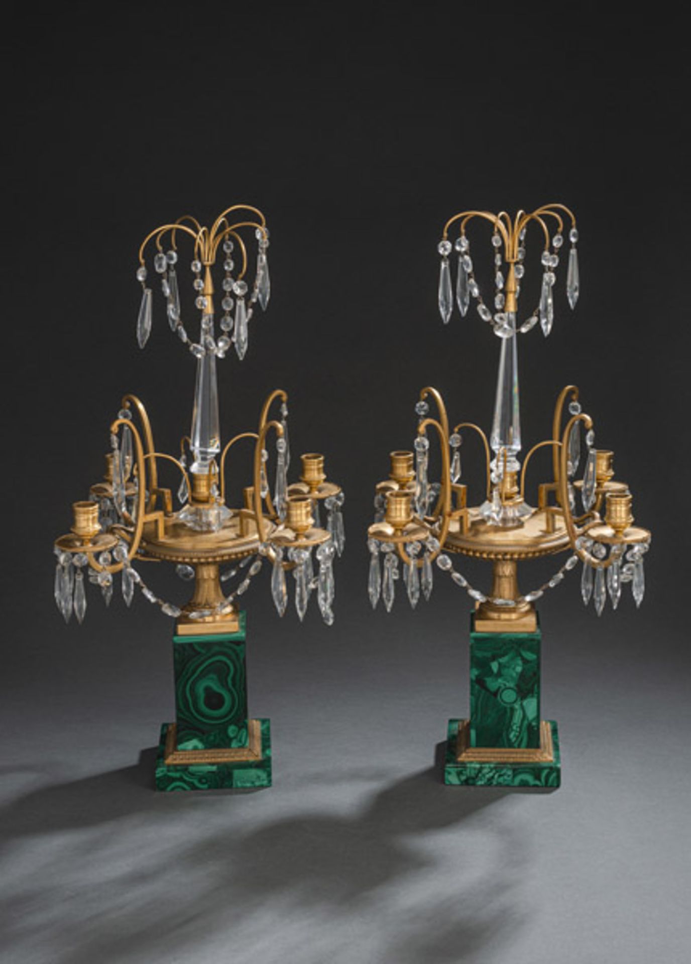 A PAIR OF GILT-BRONZE AND MALACHITE FOUR-LIGHT CANDELABRA