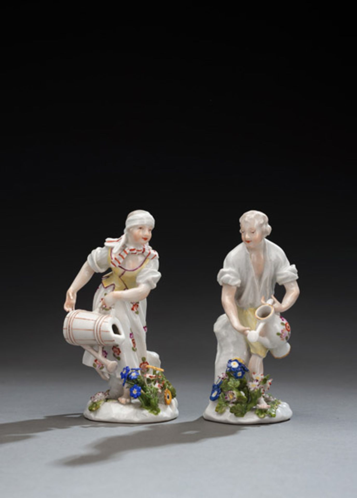 A MEISSEN PAIR OF GARDENERS WITH WATERING CANS