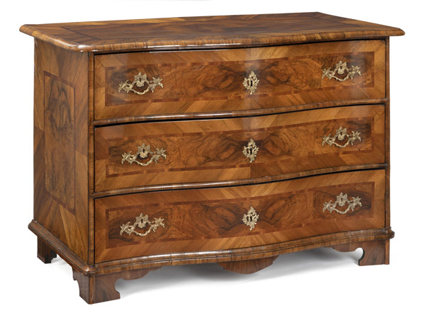 A SOUTH GERMAN BRASS MOUNTED WALNUT AND PLUM MARQUETRIED BAROQUE COMMODE