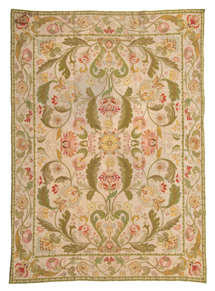 AN EMBROIDERED ARRAIOLOS CARPET WITH  FLORAL DESIGNS
