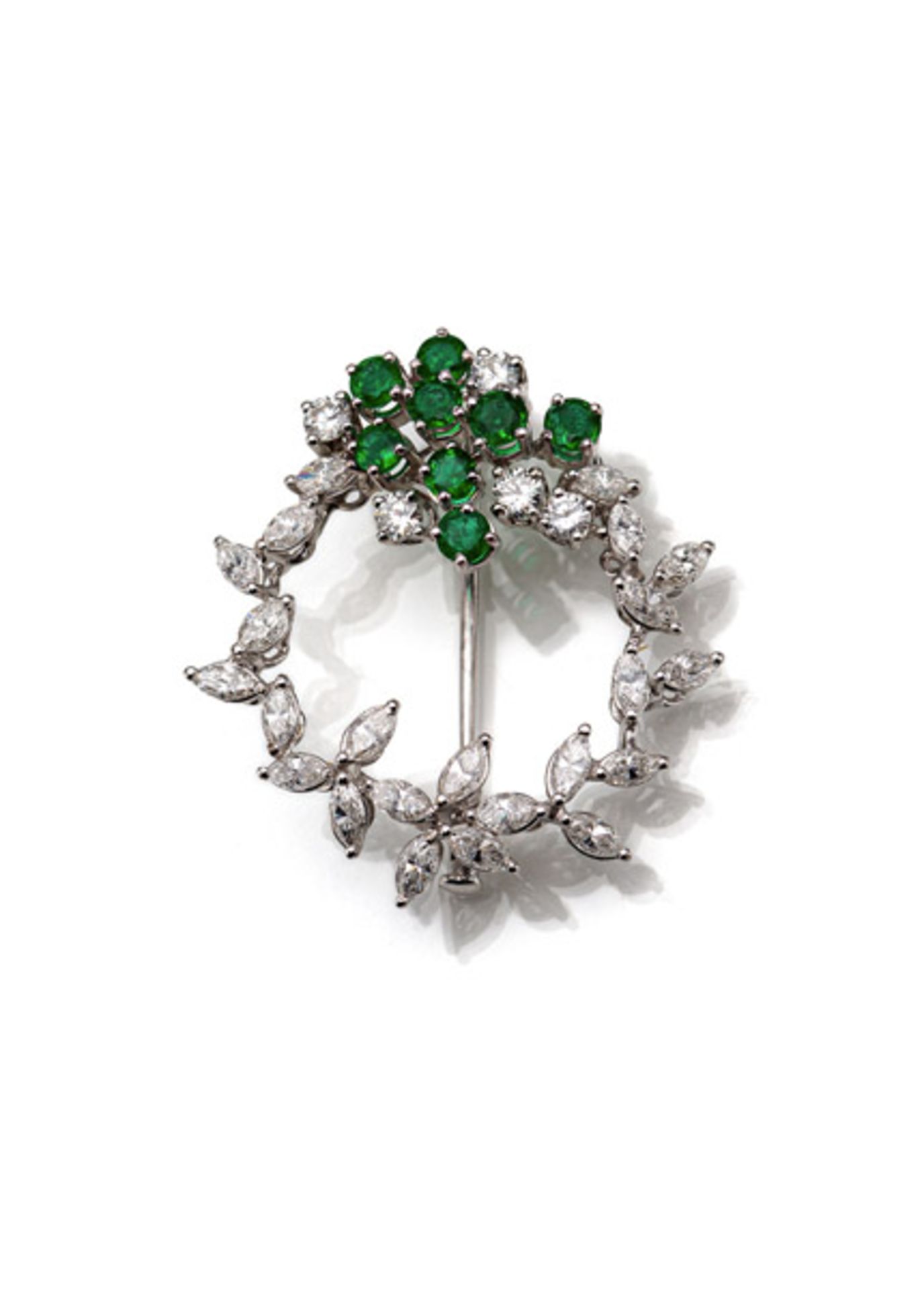 AN EMERALD AND DIAMOND BROOCH