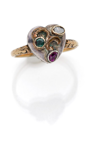 A HEART SHAPED RING WITH COLOURED STONES