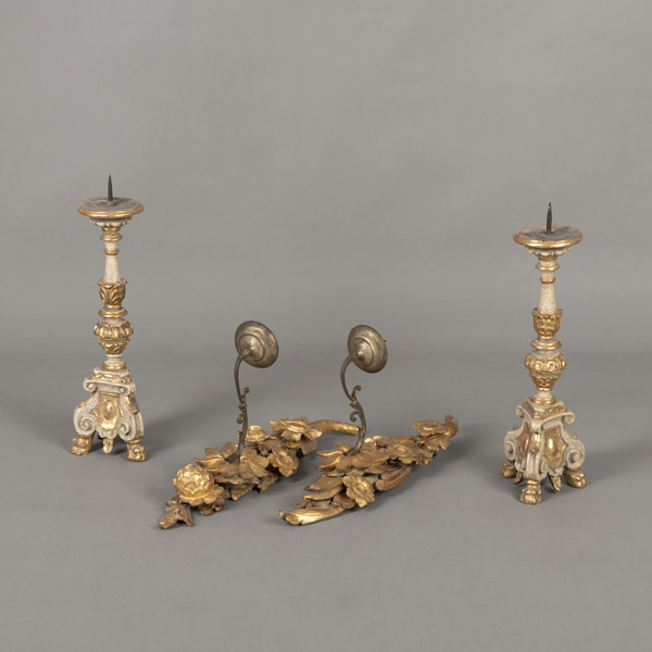 A PAIR OF WOODCARVED ALTAR CANDLESTICKS AND A PAIR OF CARVED WOOD WALL LIGHTS