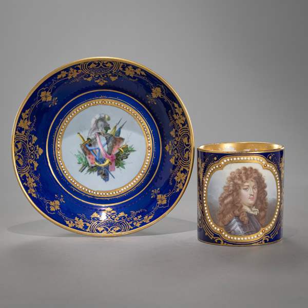A LARGE FRENCH CUP AND SAUCER WITH PORTRAIT OF LOUIS XIV