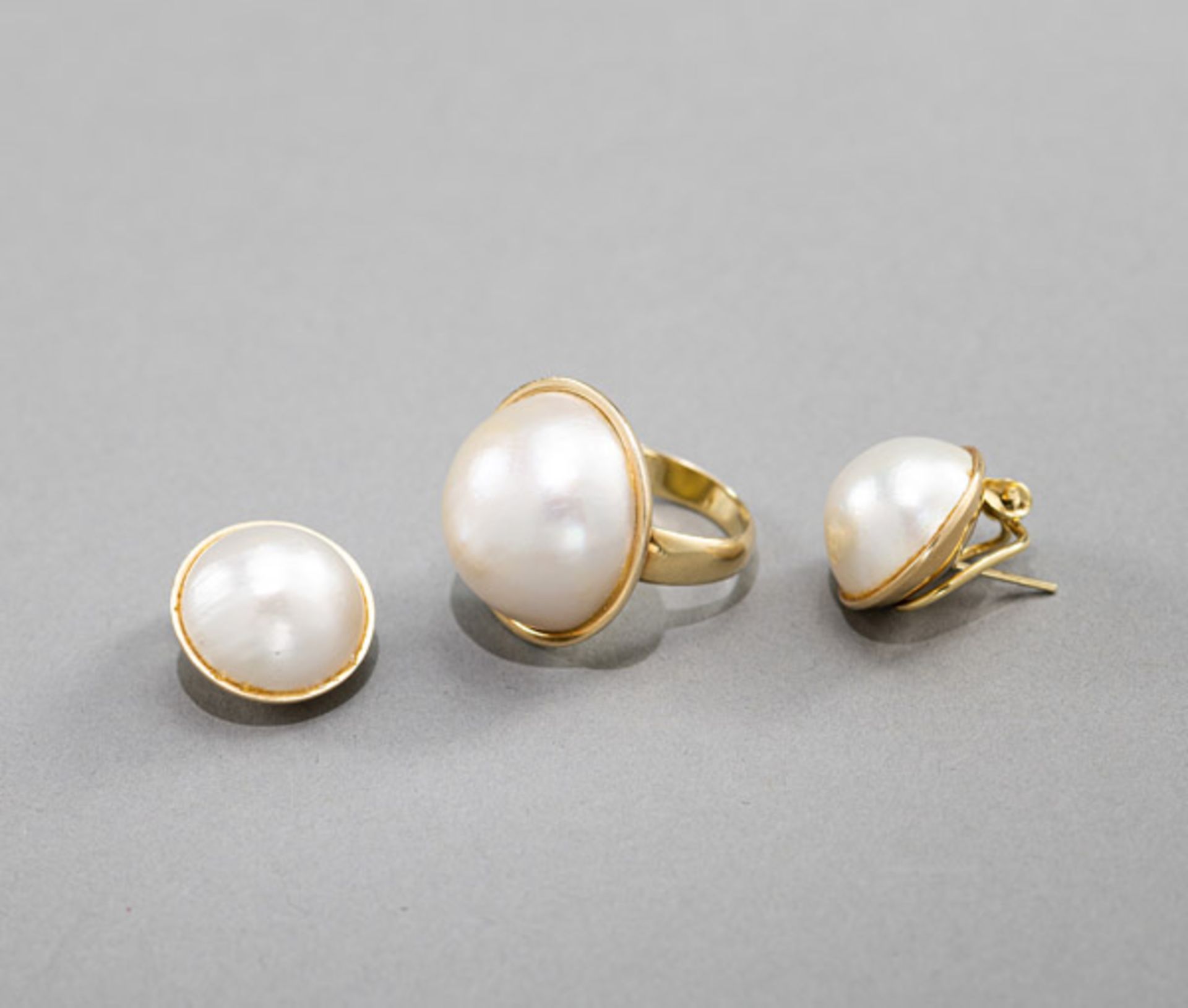 A PAIR OF PEARL EARCLIPS AND A RING