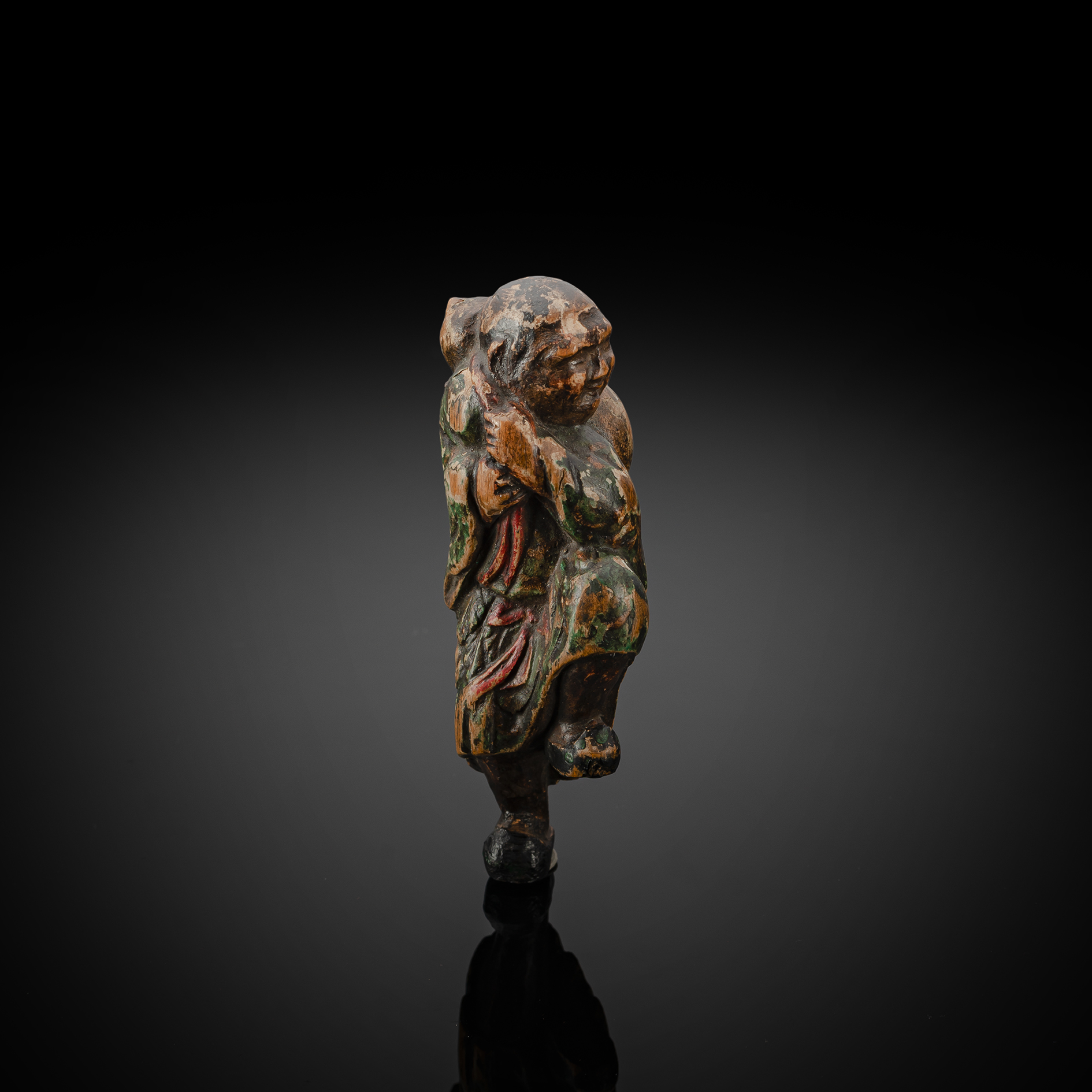 A RARE PAINTED WOOD NETSUKE OF A STANDING MAN WITH GOURD IN THE STYLE OF SHUZAN
