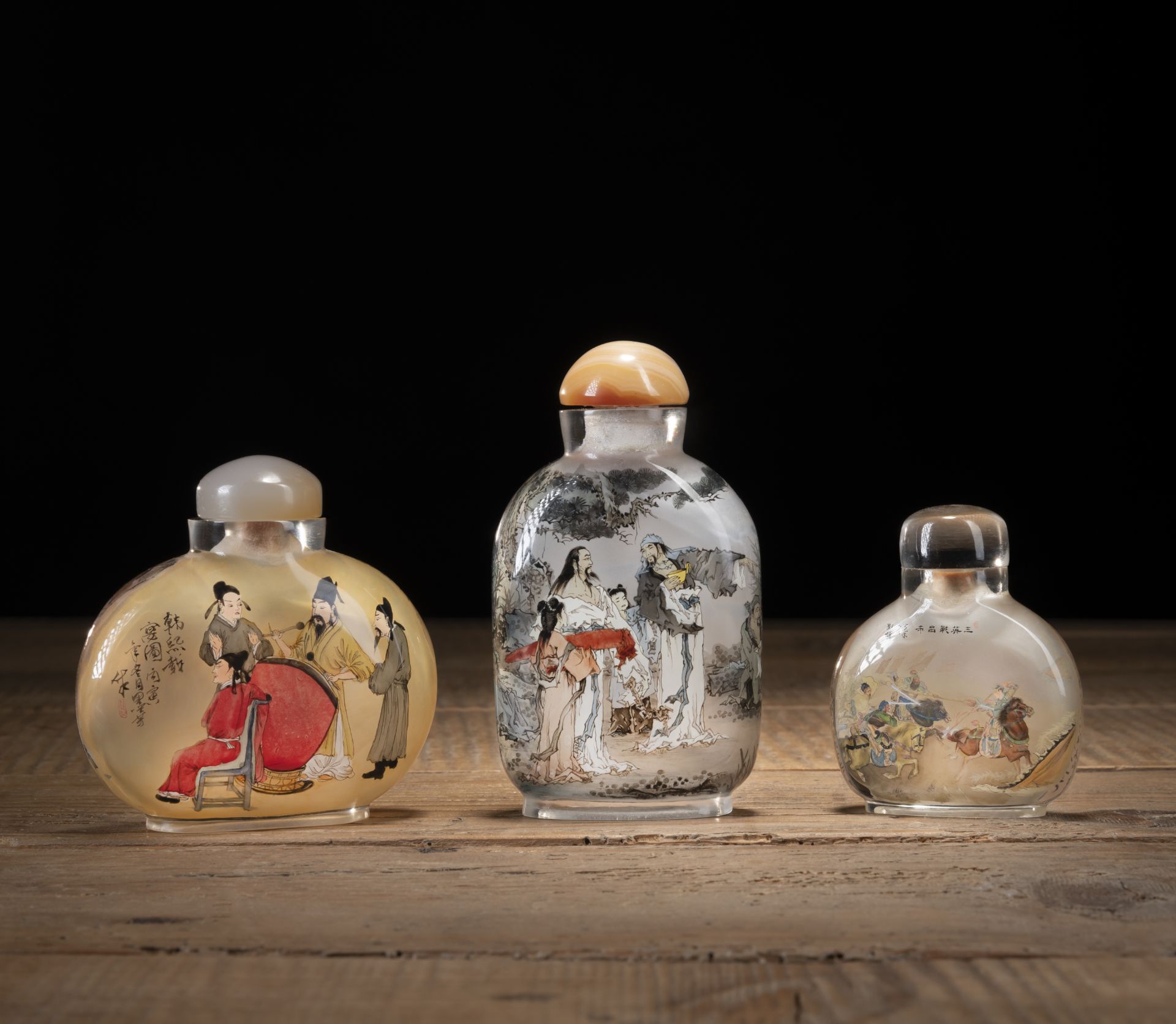 THREE GLASS SNUFF BOTTLES WITH FINE INSIDE PAINTING OF 'THE SEVEN SAGES OF THE BAMBOO GROVE', 'THE