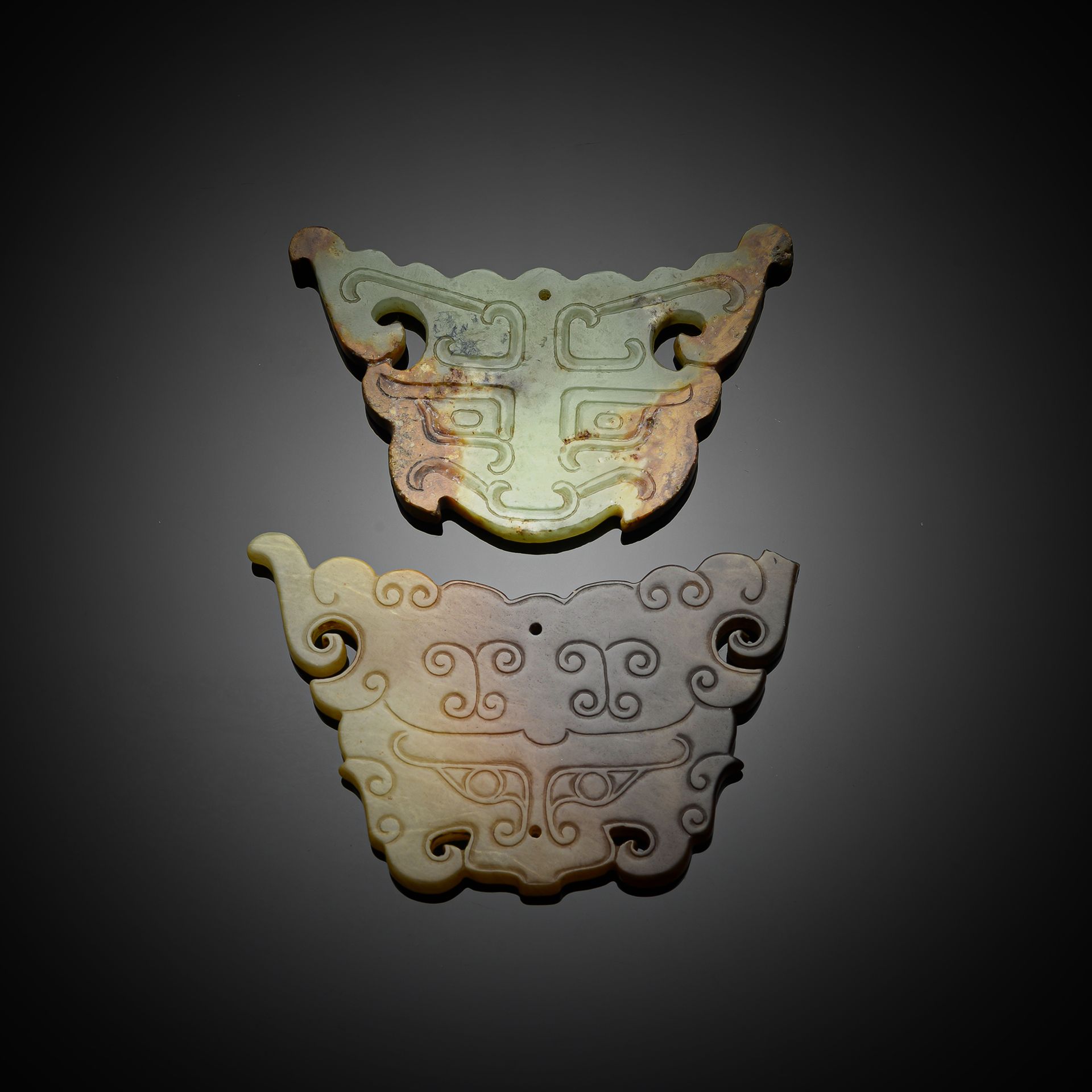 TWO 'TAOTIE' MASK JADE CARVINGS