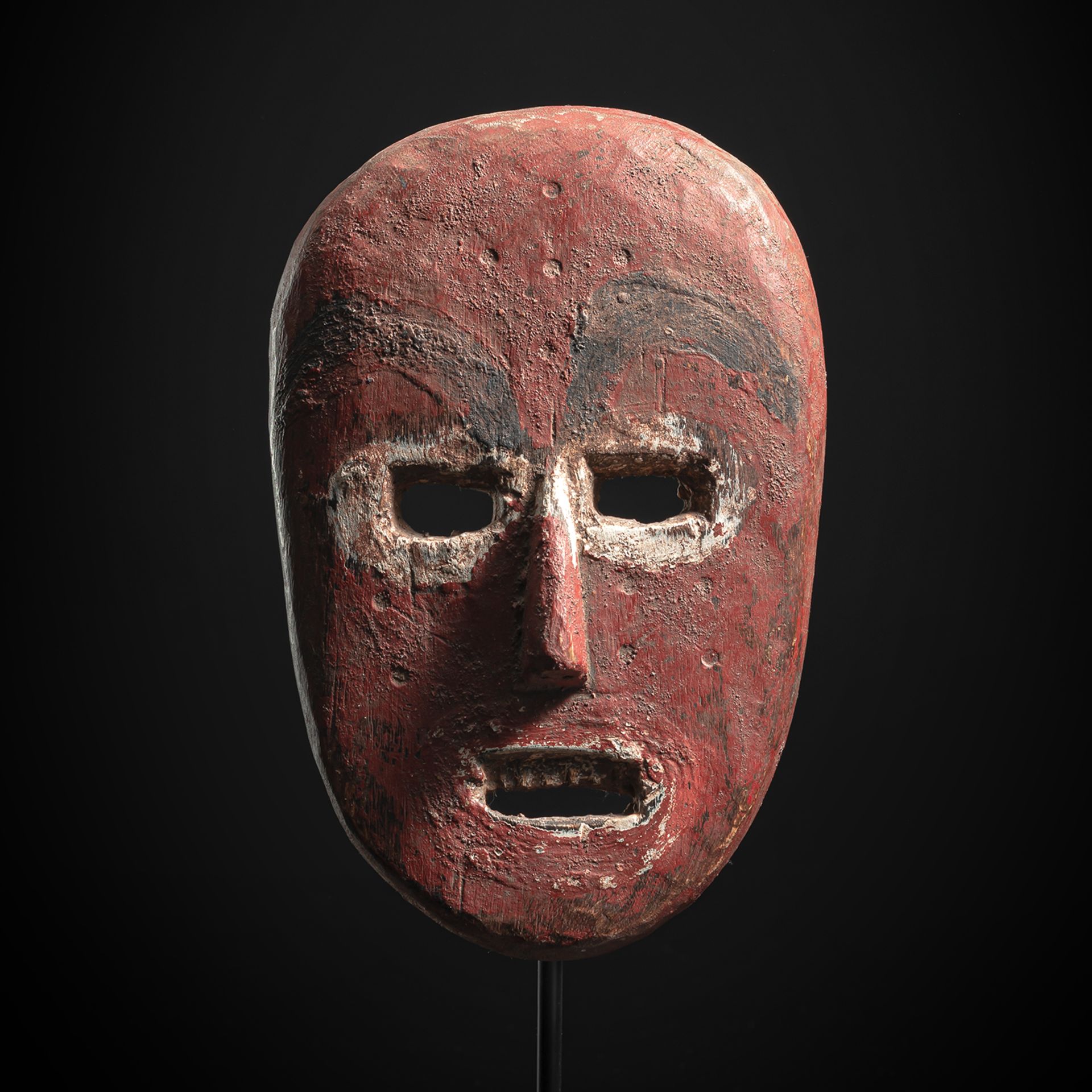 A RARE RED-PAINTED SUKUMA WOOD MASK