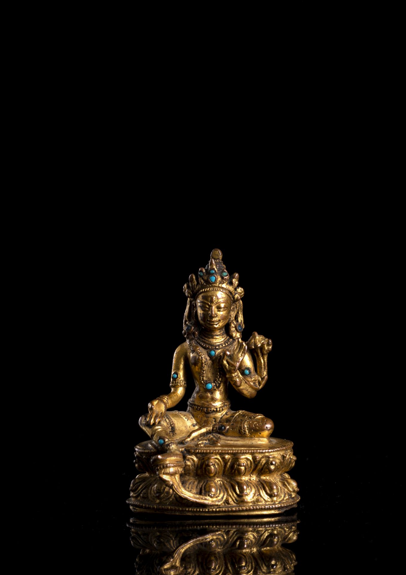 A GILT-COPPER FIGURE OF SYAMATARA