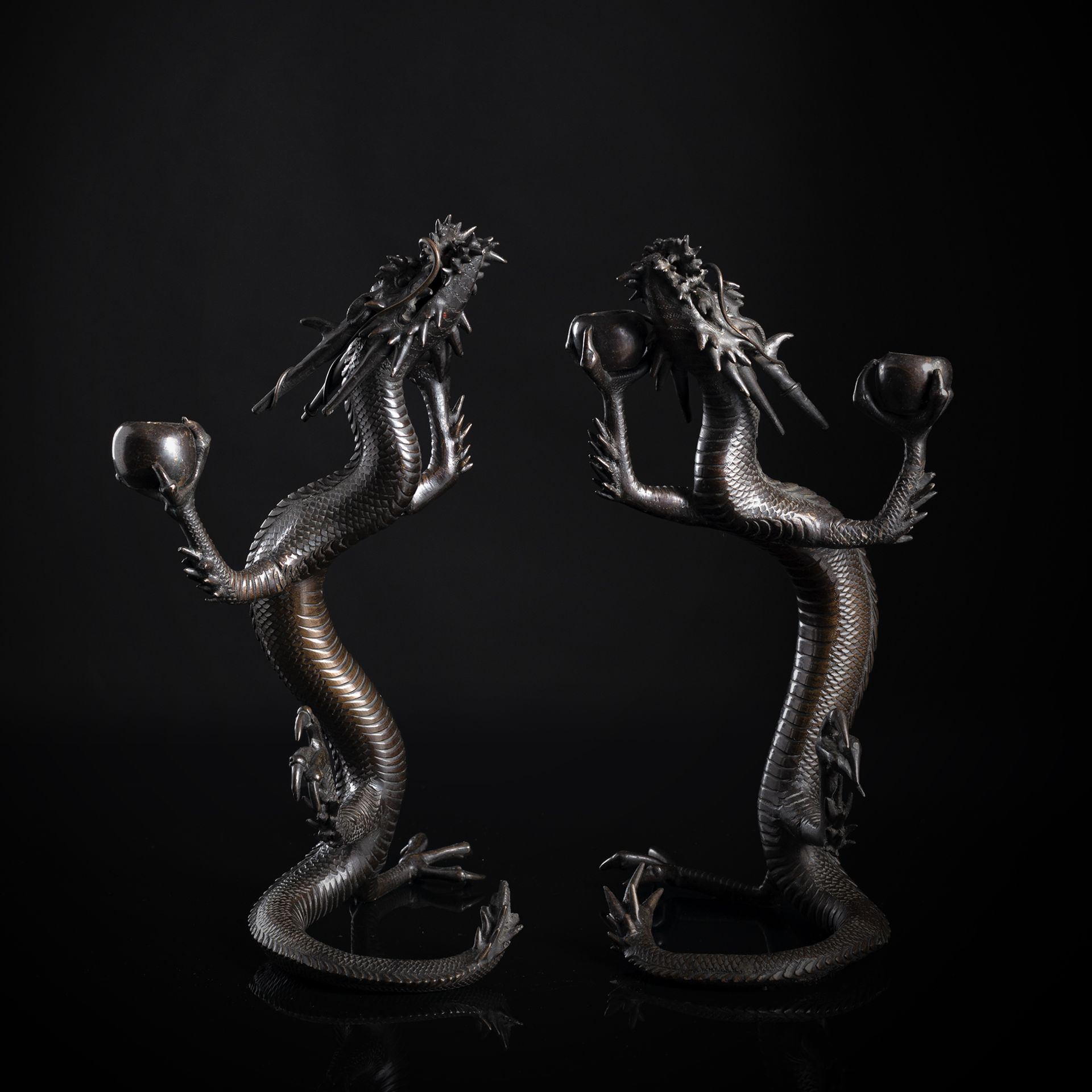 A PAIR OF DRAGON BRONZE CANDLE HOLDERS