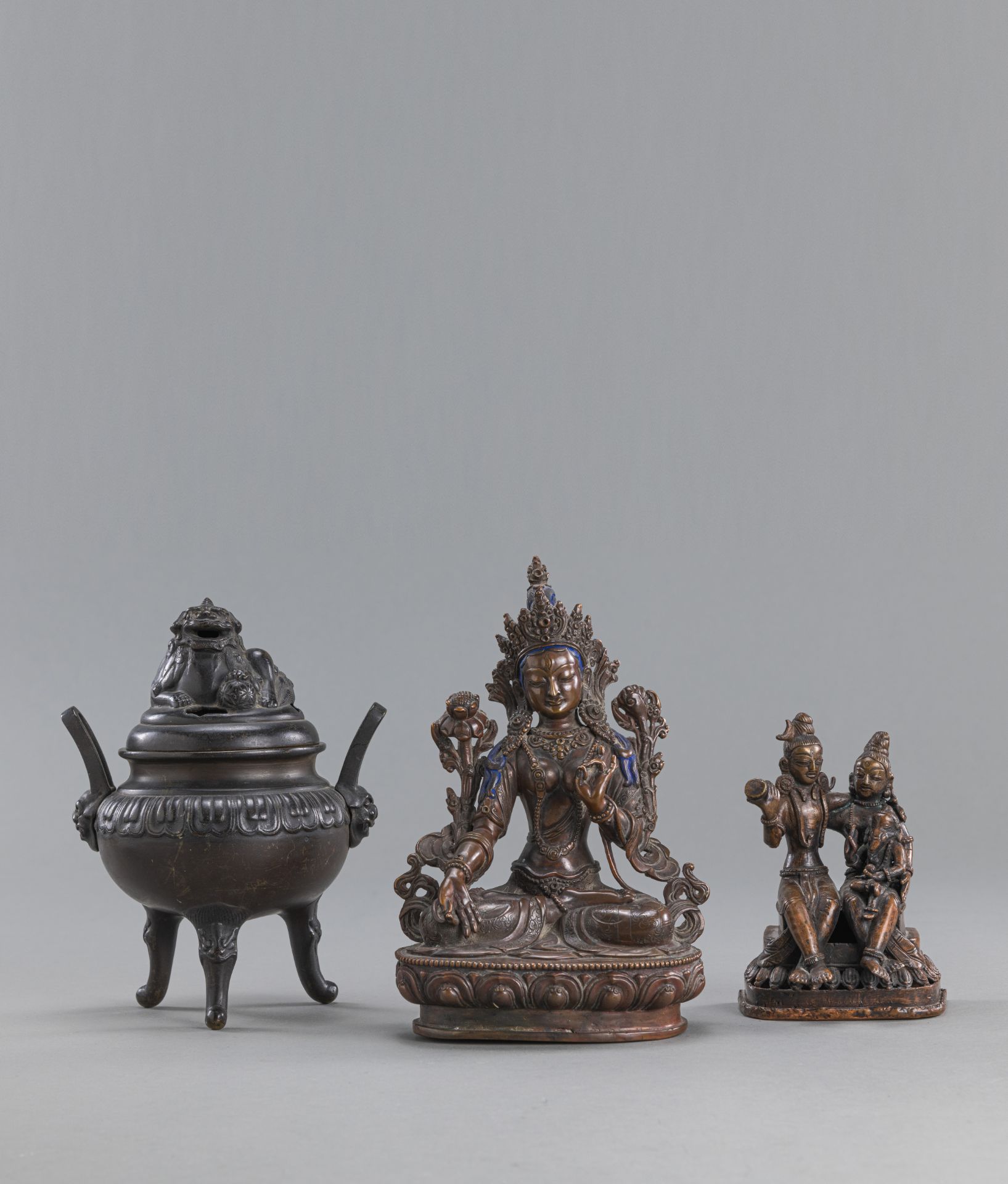 A BRONZE FIGURE OF TARA, A BRONZE FIGURE OF TARA AND A TRIPOD BRONZE CENSER WITH COVER