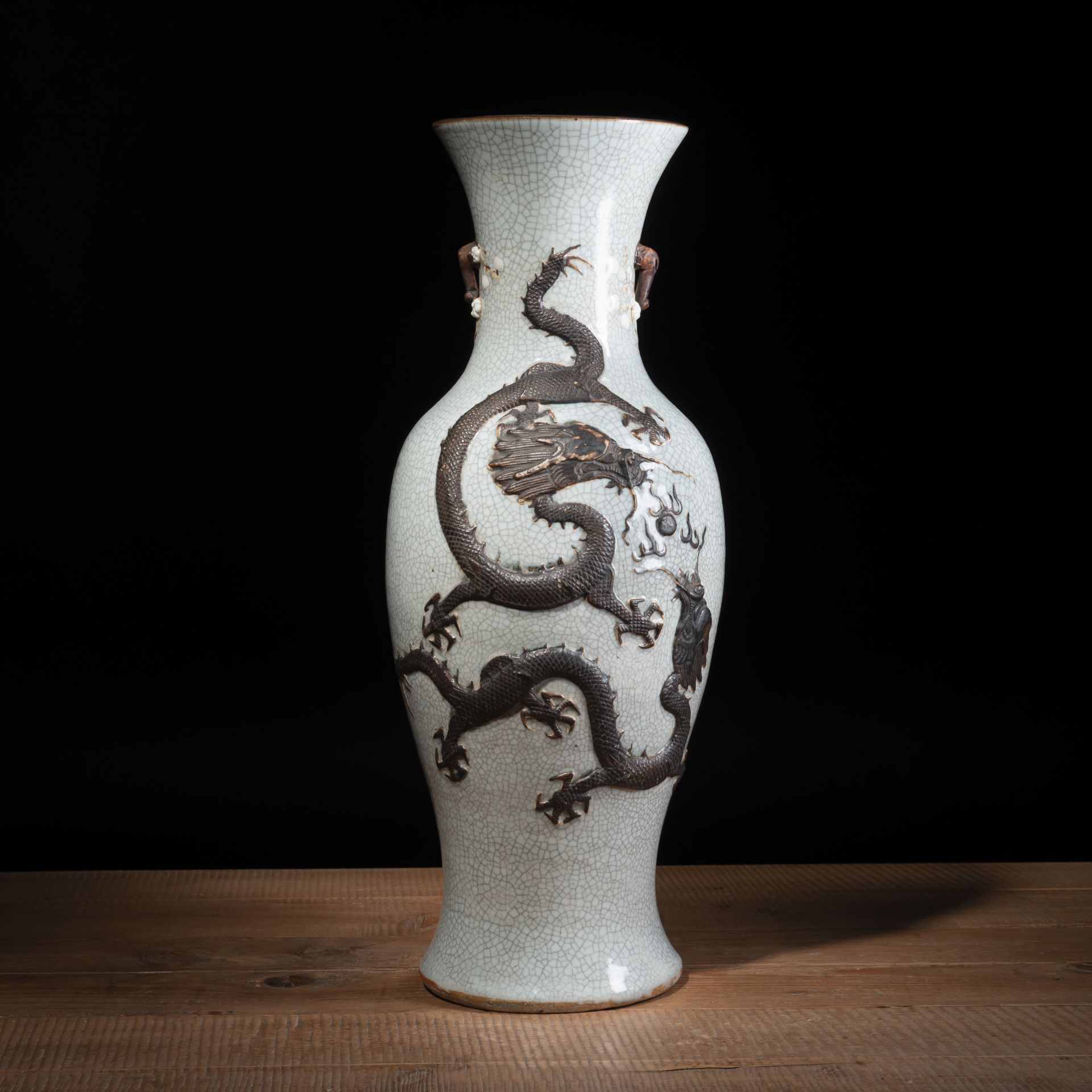 A CRACKLE-GLAZED DRAGON RELIEF VASE