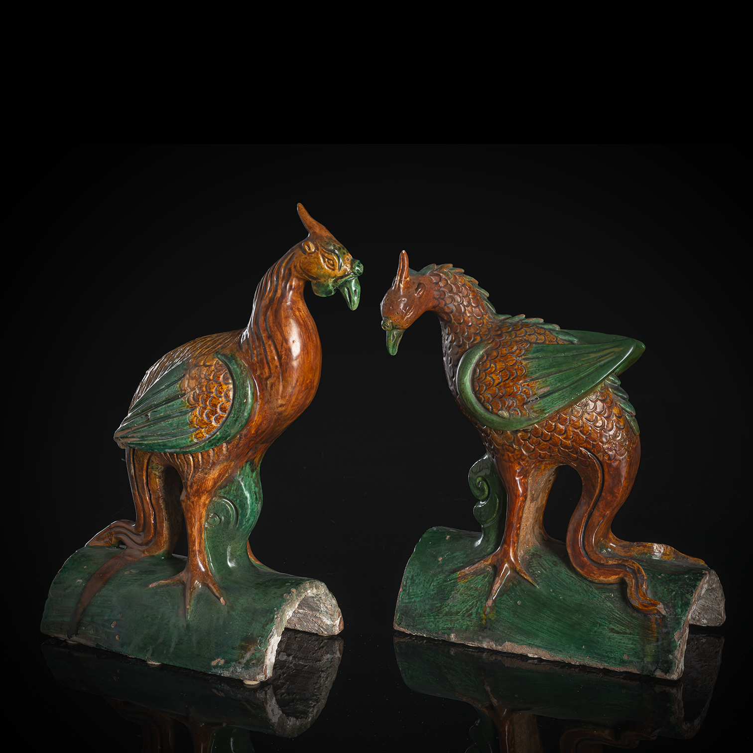 A PAIR OF SANCAI GLAZED POTTERY PHOENIX ROOF TILES