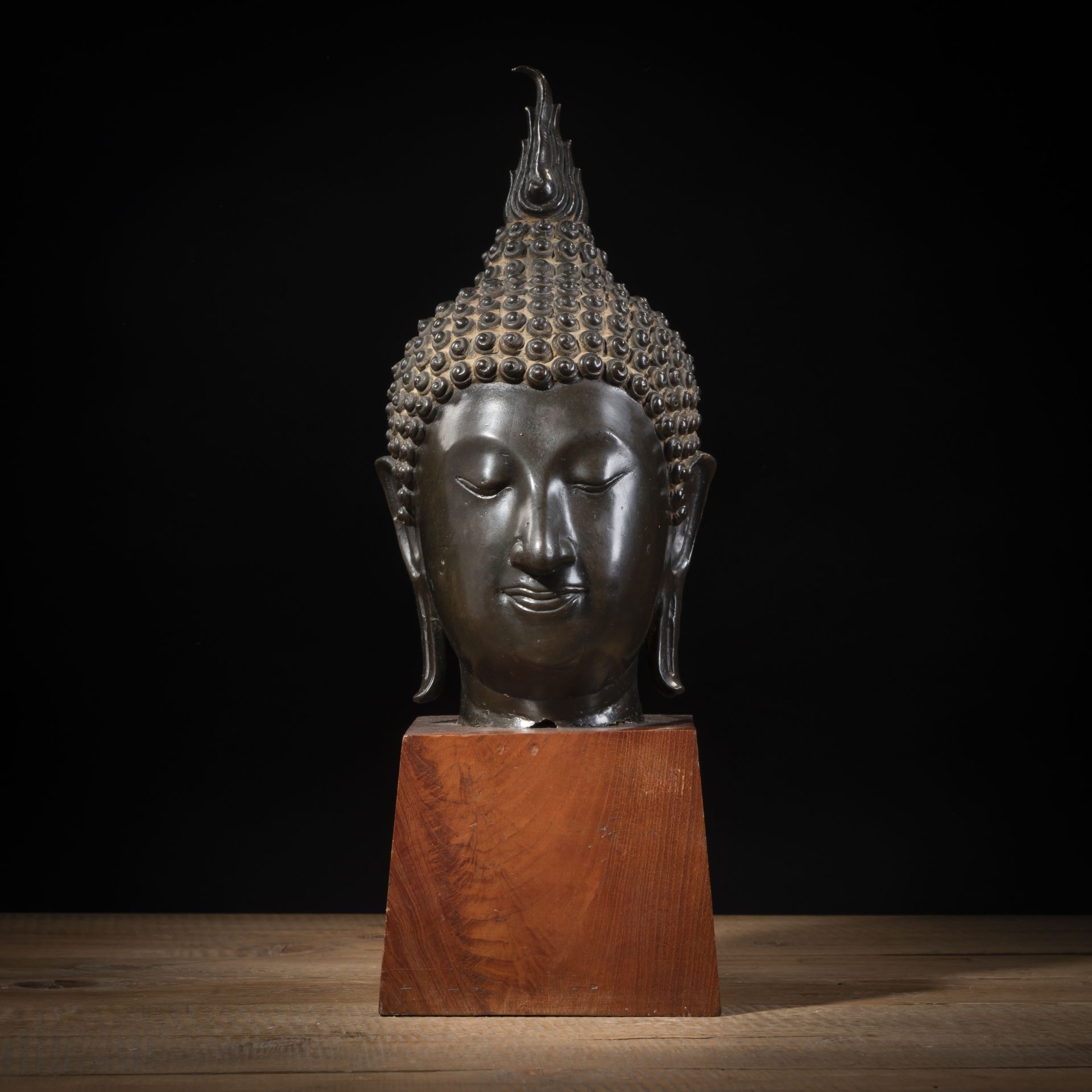 A BRONZE HEAD OF BUDDHA