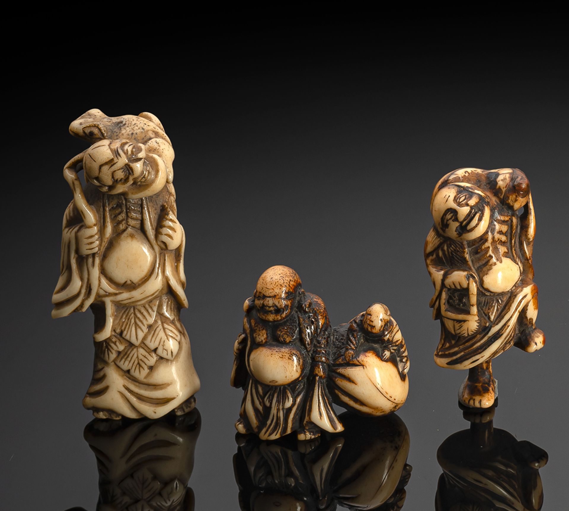 FIVE CARVED STAGANTLE NETSUKE OF HOTEI, A STANDING MAN, GAMA SENNIN AND TWO FIGURES OF CHÔKARÔ SENN