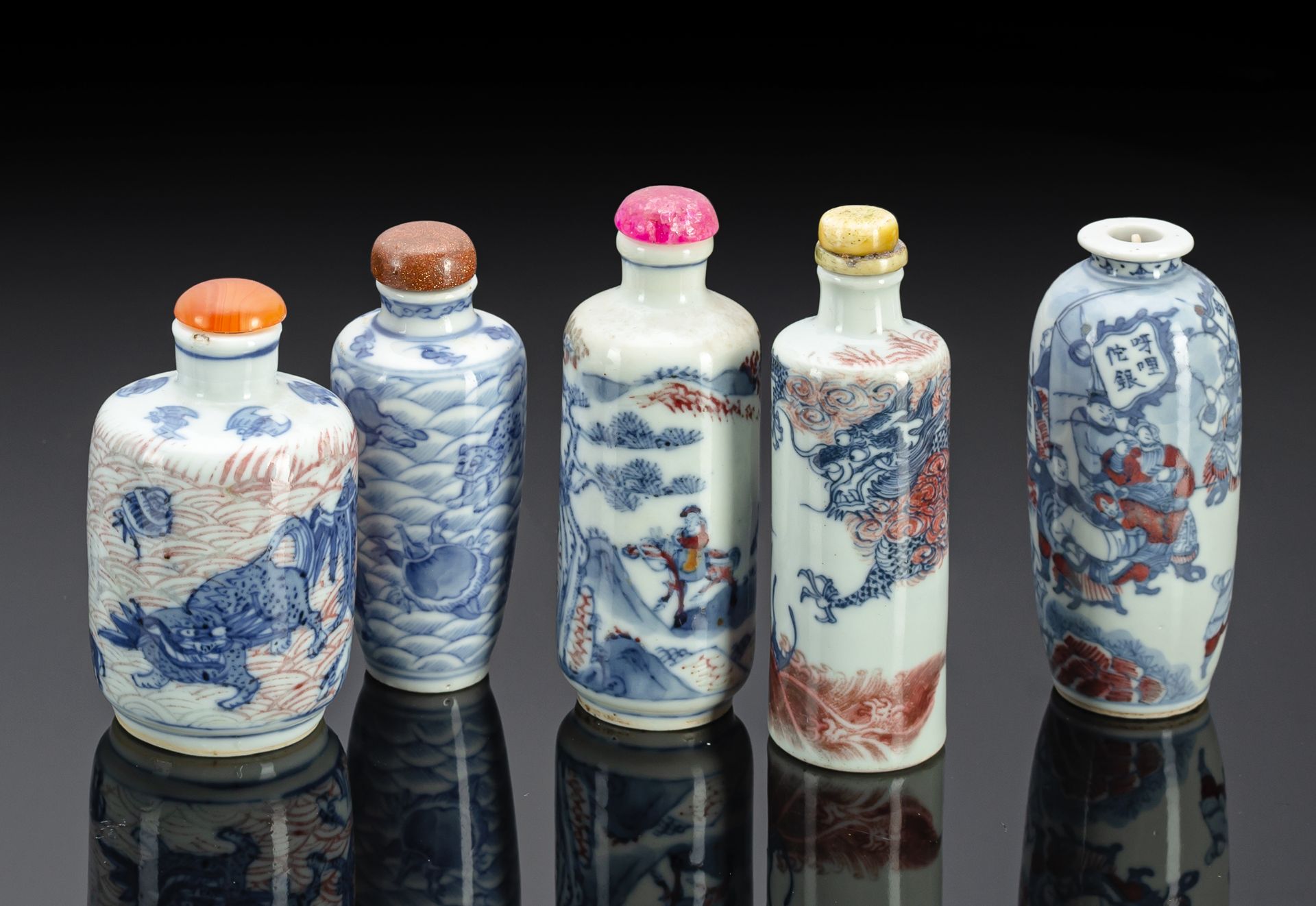 A GROUP OF FIVE COPPER-RED AND UNDERGLAZE DECORATED SNUFFBOTTLES