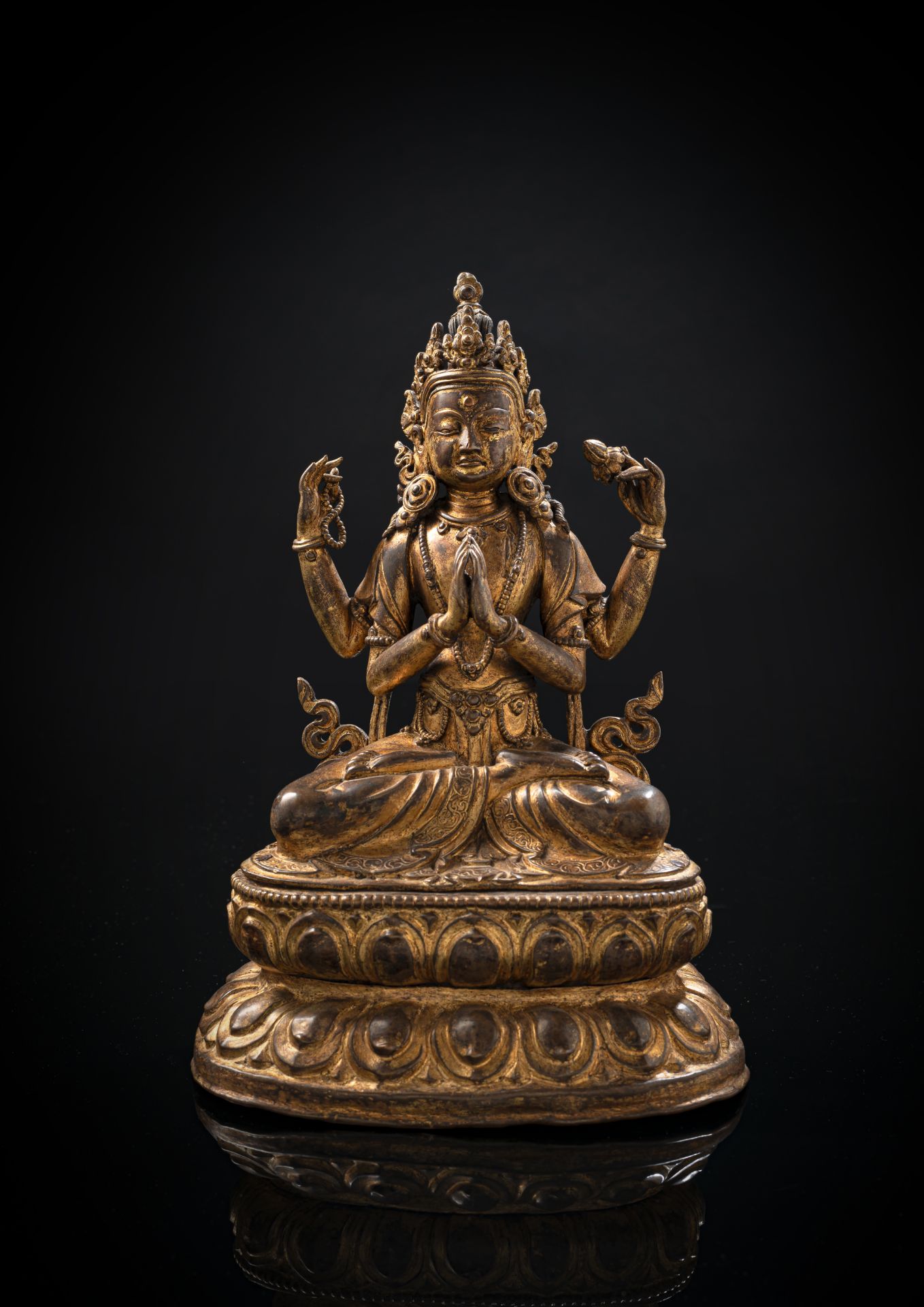 ﻿A GILT-BRONZE FIGURE OF SADAKSHARILOKESHVARA