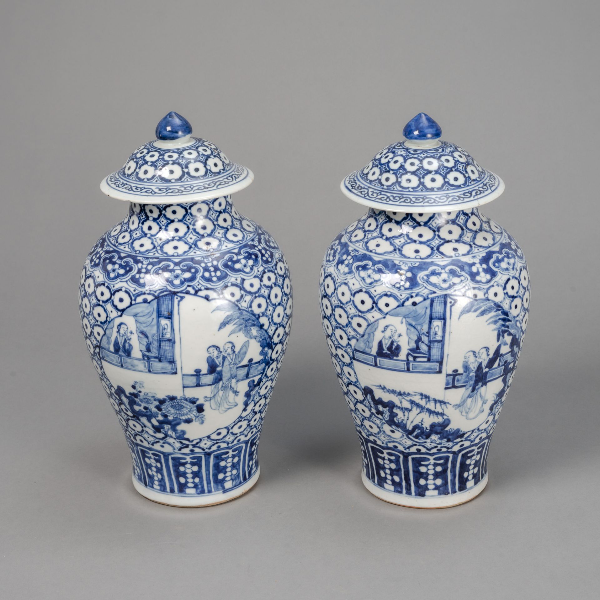 A PAIR OF UNDERGLAZE-BLUE PAINTED PORCELAIN VASES WITH COVERS
