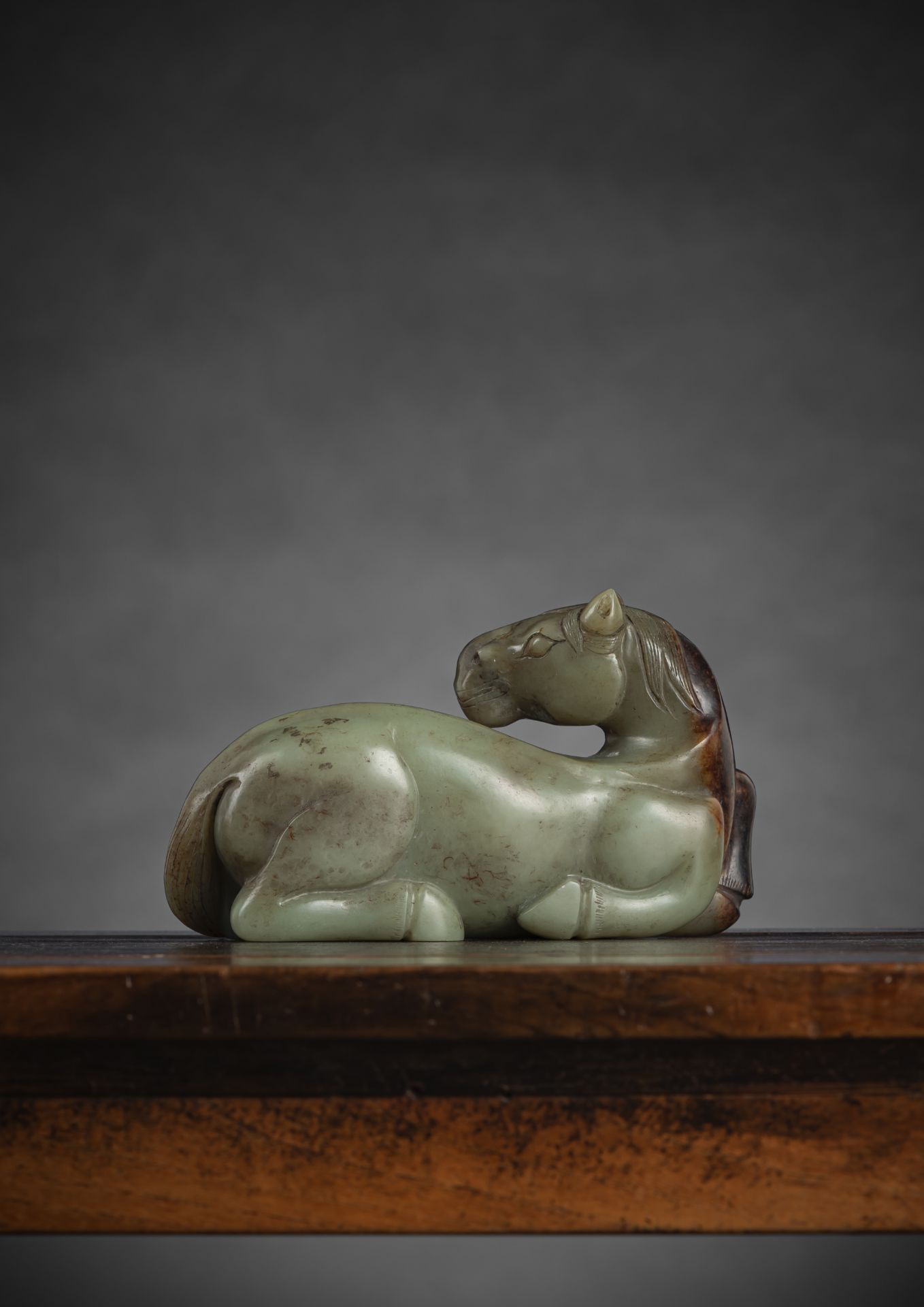 A FINE AND RARE LARGE CELADON JADE RECUMBENT HORSE - Image 2 of 9