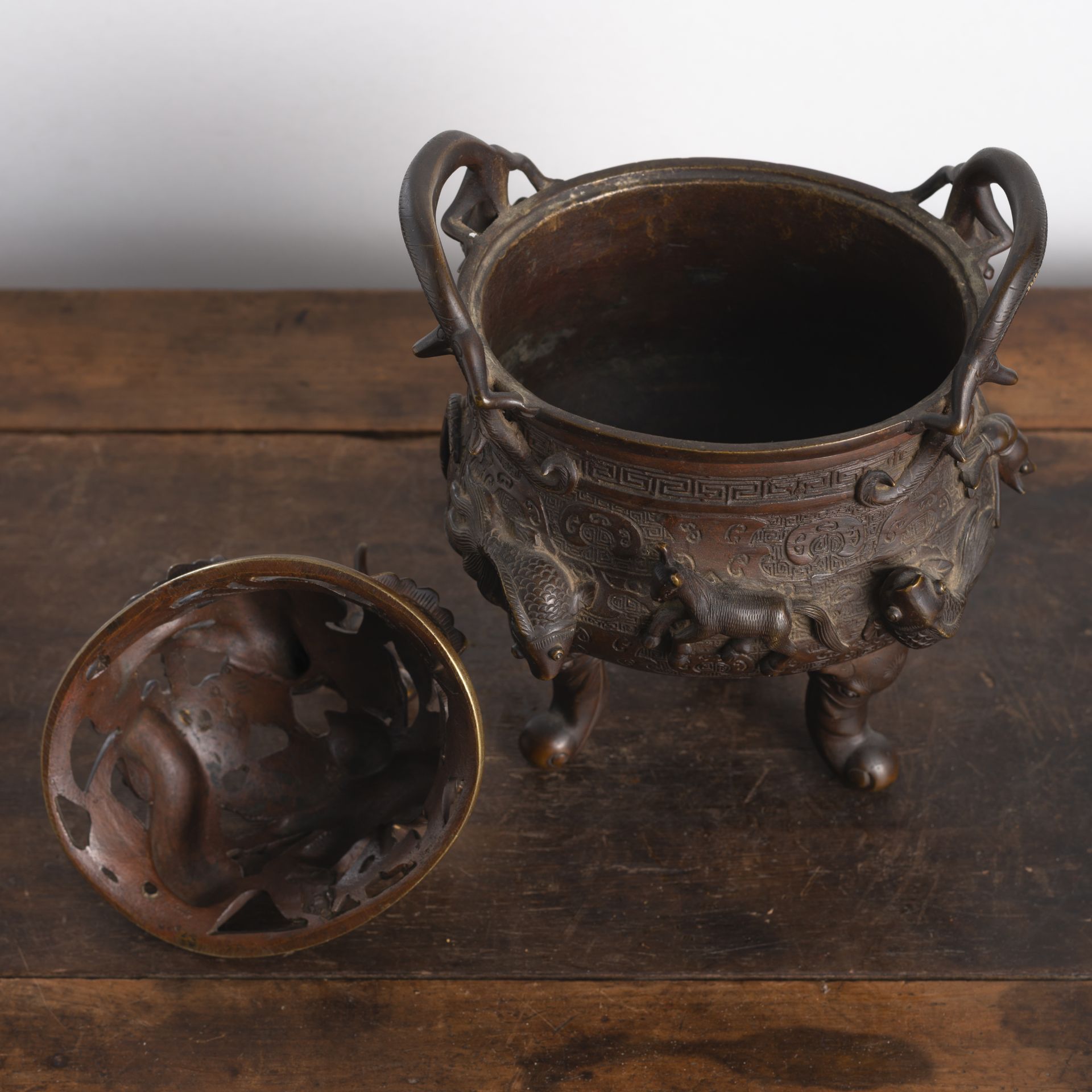A GOOSE, HORSE, AND FISH RELIEF TRIPOD BRONZE CENSER AND OPENWORK DRAGON COVER - Image 2 of 6