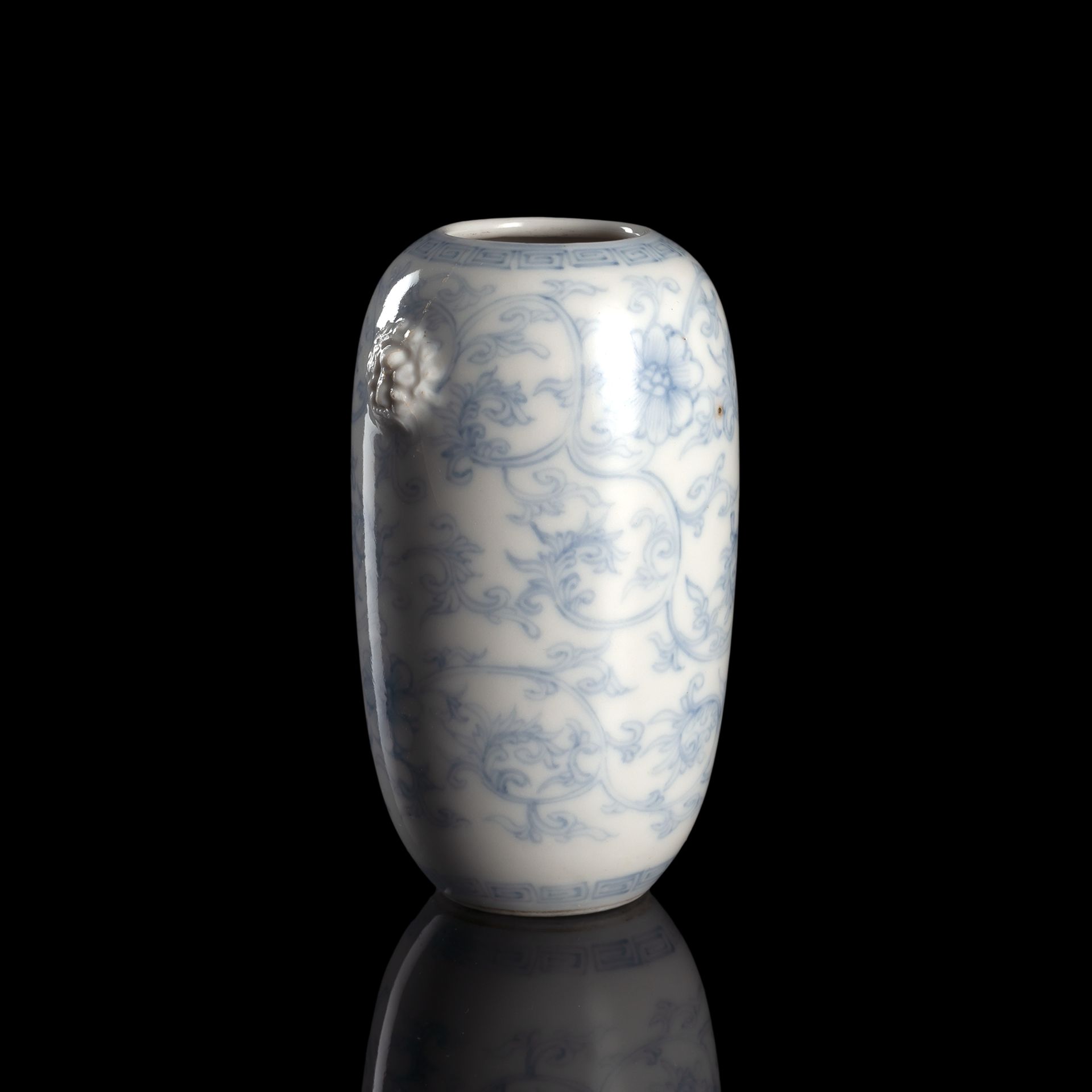 A BLUE AND WHITE FLOWER VASE WITH TWO MASK HANDLES