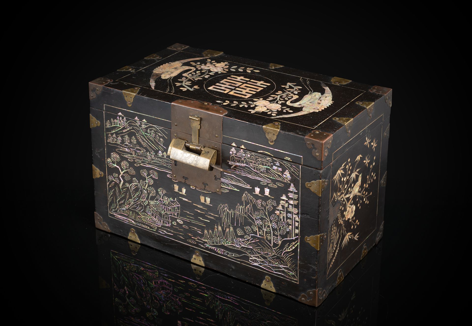 A RECTANGULAR BLACL-LACQUERED AND MOTHER-OF-PEARL INLAID WOODEN BOX AND COVER